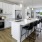 pendant lights over kitchen island with seating