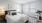 carpeted bedroom with large windows