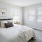 carpeted bedroom with large windows