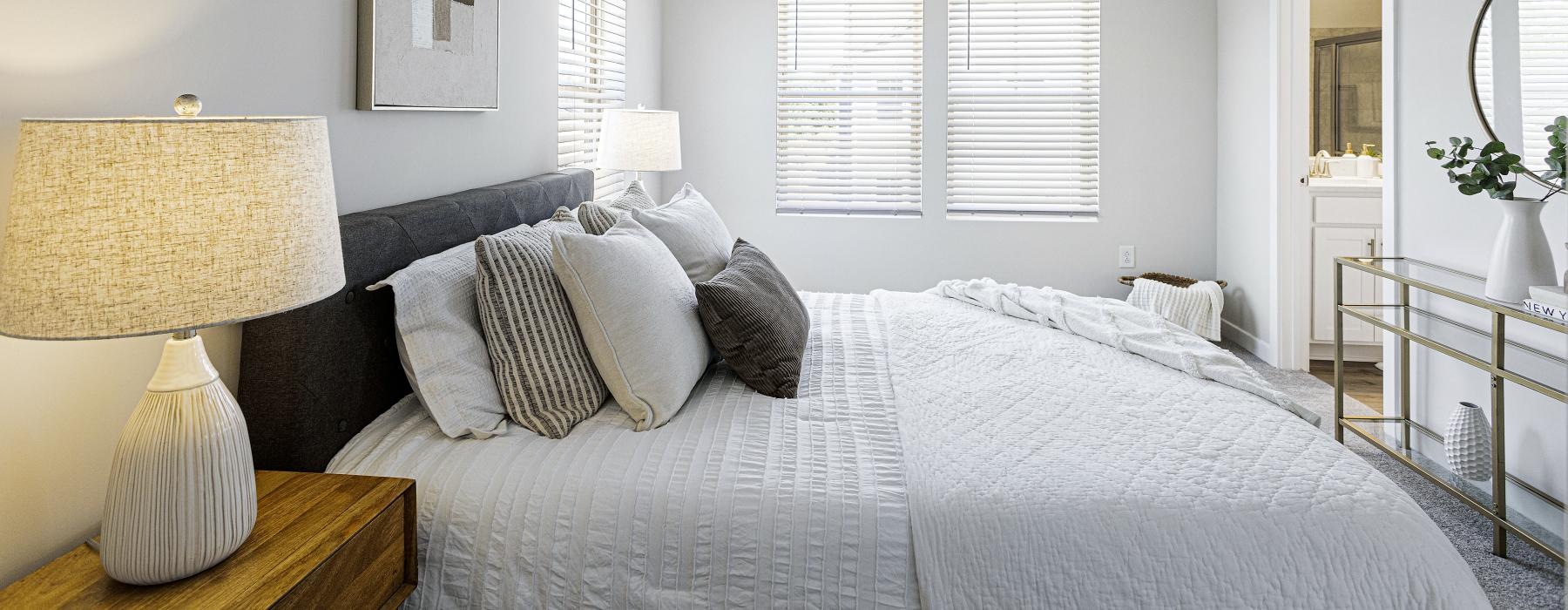 well lit bedroom with private bathroom