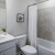 a bathroom with a tub toilet and sink