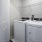 side-by-side washer/dryer units in laundry closet