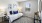 a bedroom with a bed and lamps