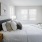 well lit bedroom with private bathroom